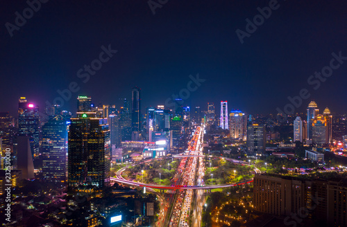 Jakarta city with glowing lights in hectic traffic