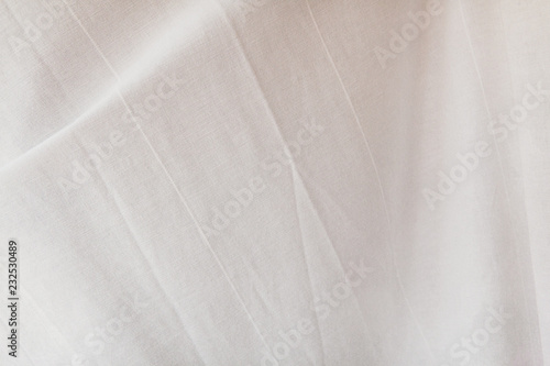 Natural white cotton fabric texture corrugated and crumpled