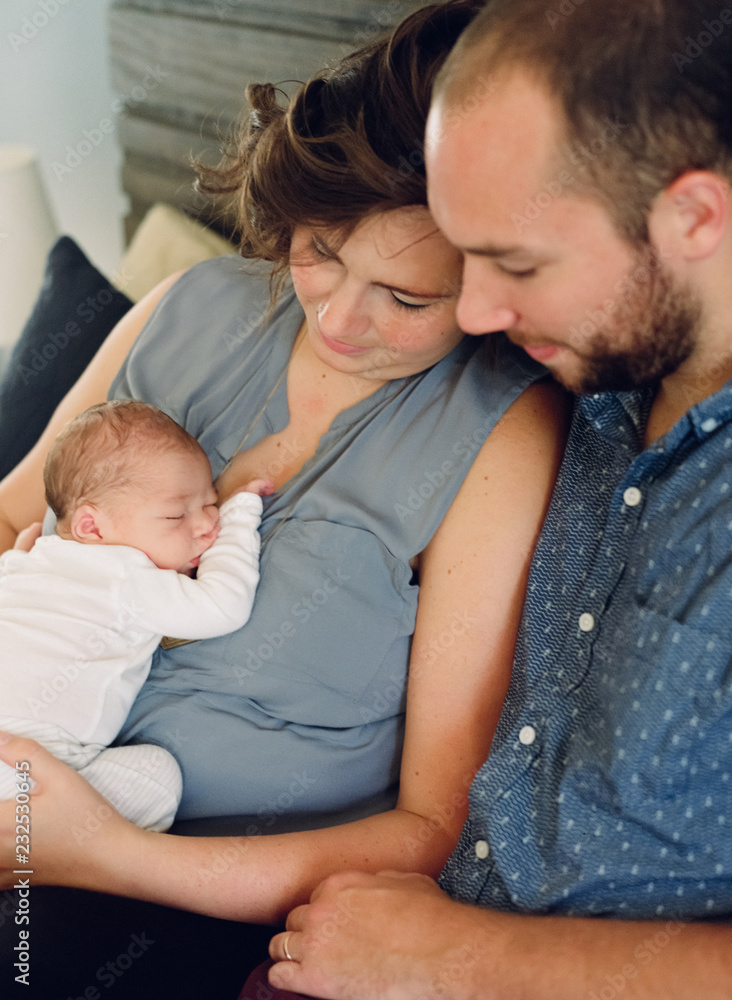 Mother and father adoring their newborn son Mother and father adoring their newborn son