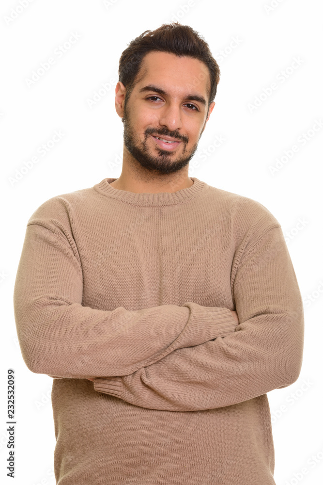 Portrait of young happy Indian man smiling Portrait of young happy Indian man smiling