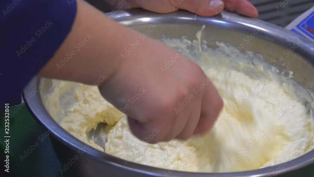 A man's hand stirring white sauce. The chef prepares the sauce and cheese. Food. Kitchen. healthy diet. Close up. HD A man's hand stirring white sauce. The chef prepares the sauce and cheese. Food. Kitchen. healthy diet. Close up. HD