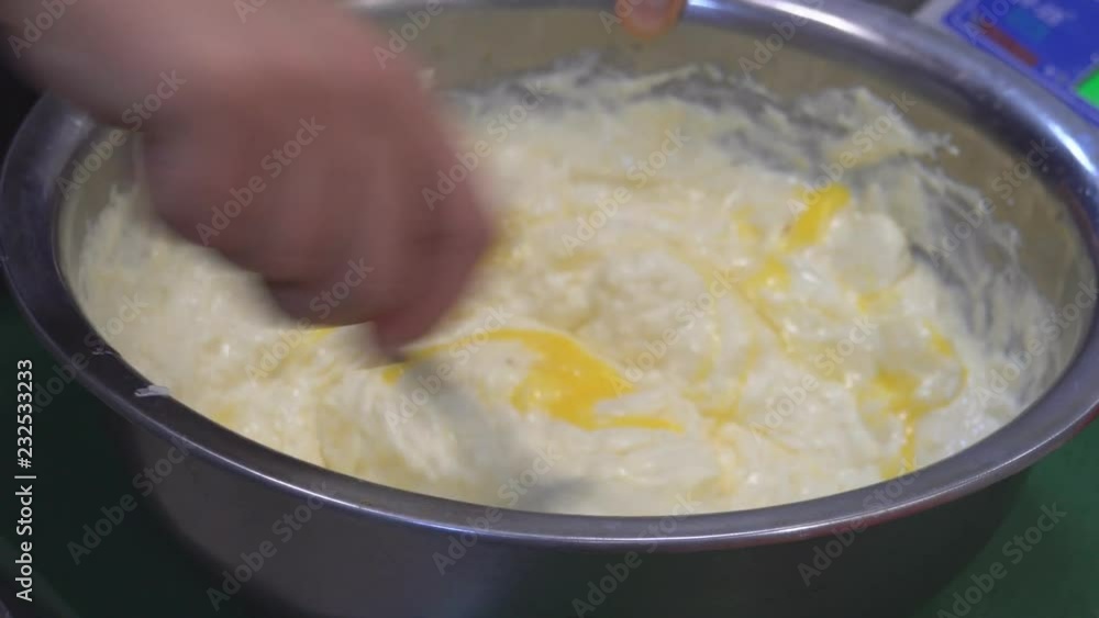 A man's hand stirring white sauce. The chef prepares the sauce and cheese. Food. Kitchen. healthy diet. Close up. HD A man's hand stirring white sauce. The chef prepares the sauce and cheese. Food. Kitchen. healthy diet. Close up. HD