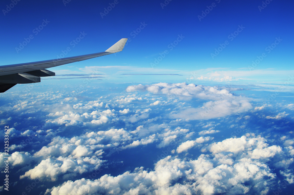 the wing of the plane in the clouds the wing of the plane in the clouds