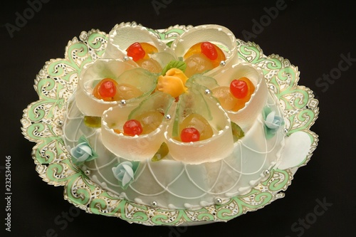 Italian food recipe, the traditional Sicily dessert Cassata prepared with marzipan, sponge cake, ricotta cheese, candied fruit, chocolate photo