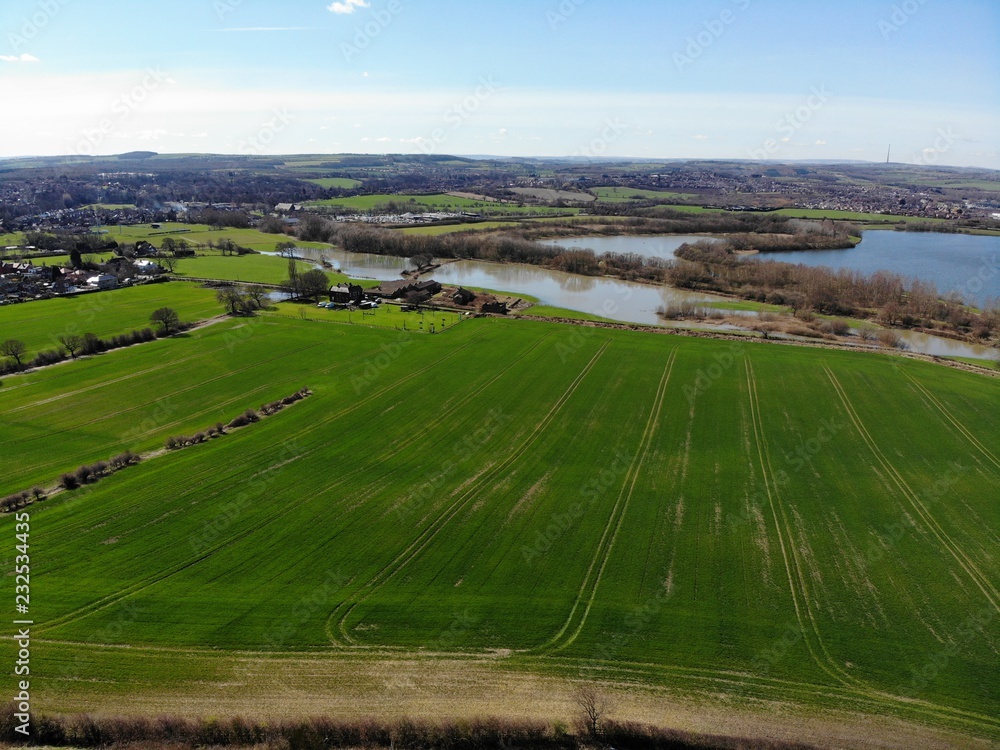 Aerial photo of a farmers field over looking a large lake
