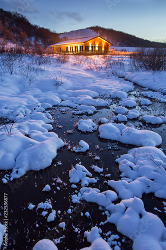 Beautiful wooden hut in win...