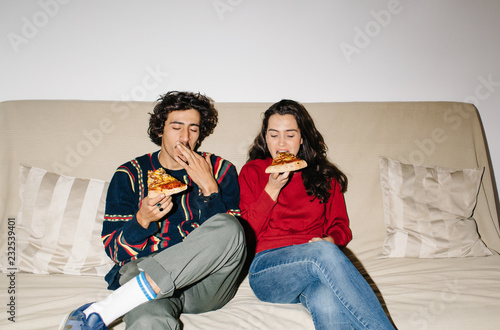 Couple enjoying pizza photo