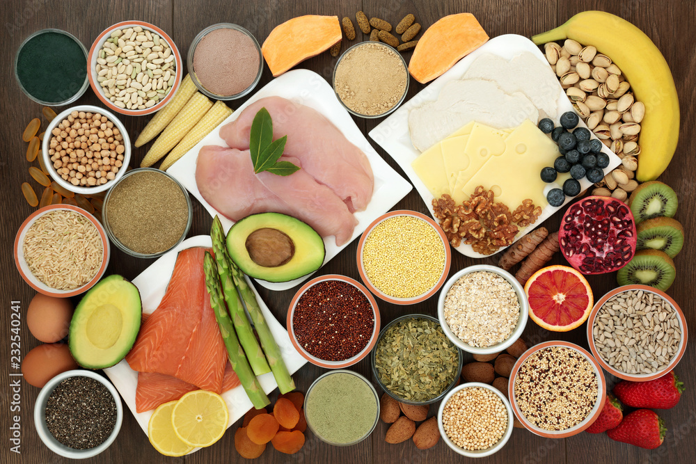 Φωτογραφία Health food for body builders high in protein including lean meat, salmon, dairy, dietary supplement powders, and tablets, pulses, grains, cereals, nuts and seeds