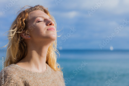 Happy woman outdoor wearing jumper photo