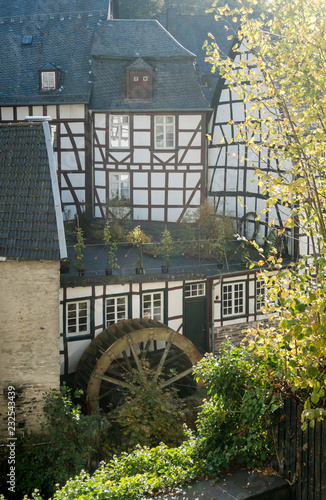 Old water mill and wheel in the hHstoric town of Monschau, Germany photo