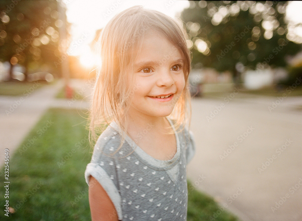 little girl in sunny street little girl in sunny street