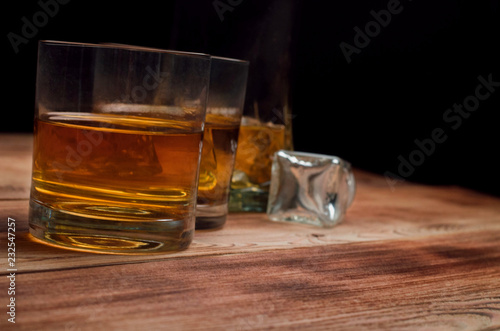 Glasses for whiskey on a wooden table