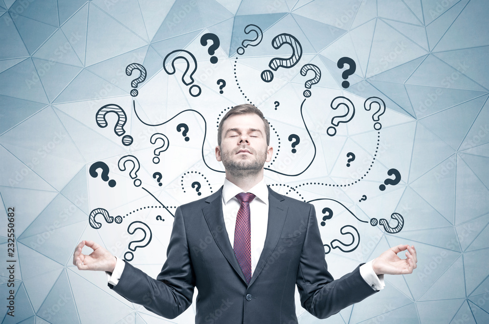 Meditating businessman, question marks Meditating businessman, question marks