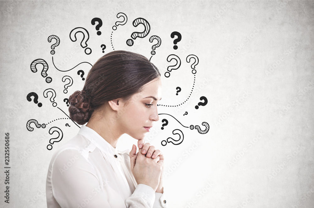 Pensive young businesswoman, many questions Pensive young businesswoman, many questions