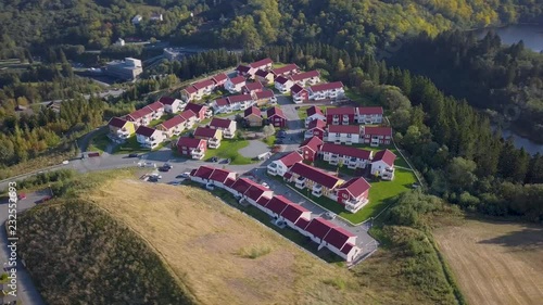 Aerial Capture of the Block of Houses in Trondheim, Norway - Sunny Summer Day with an overview of the city and Mountains in the Background