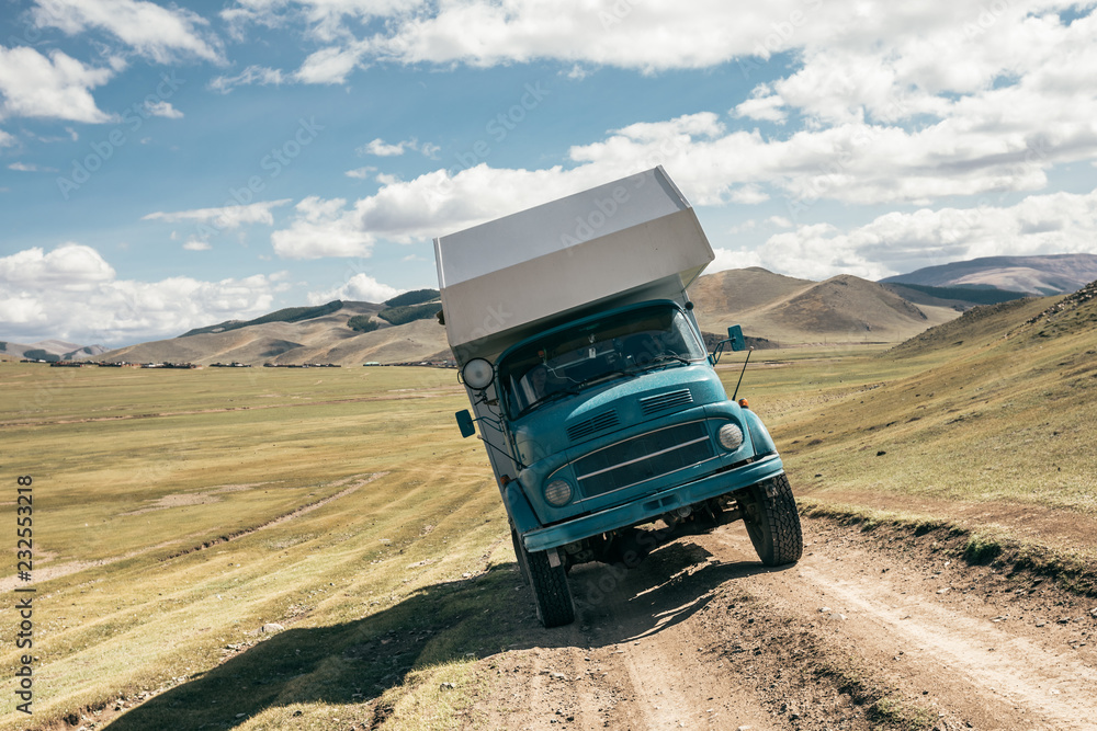 © Stocksy - camping truck standing sideways on an offroad pist in mongolia