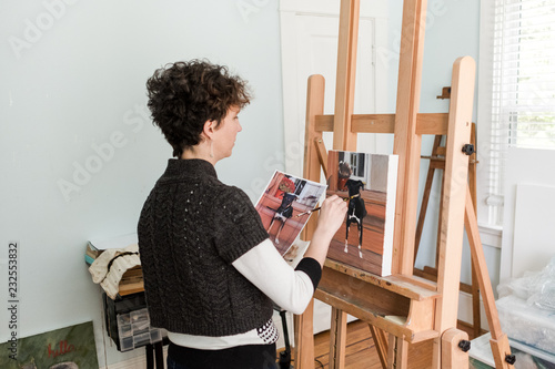 Woman painting from a dog photo photo