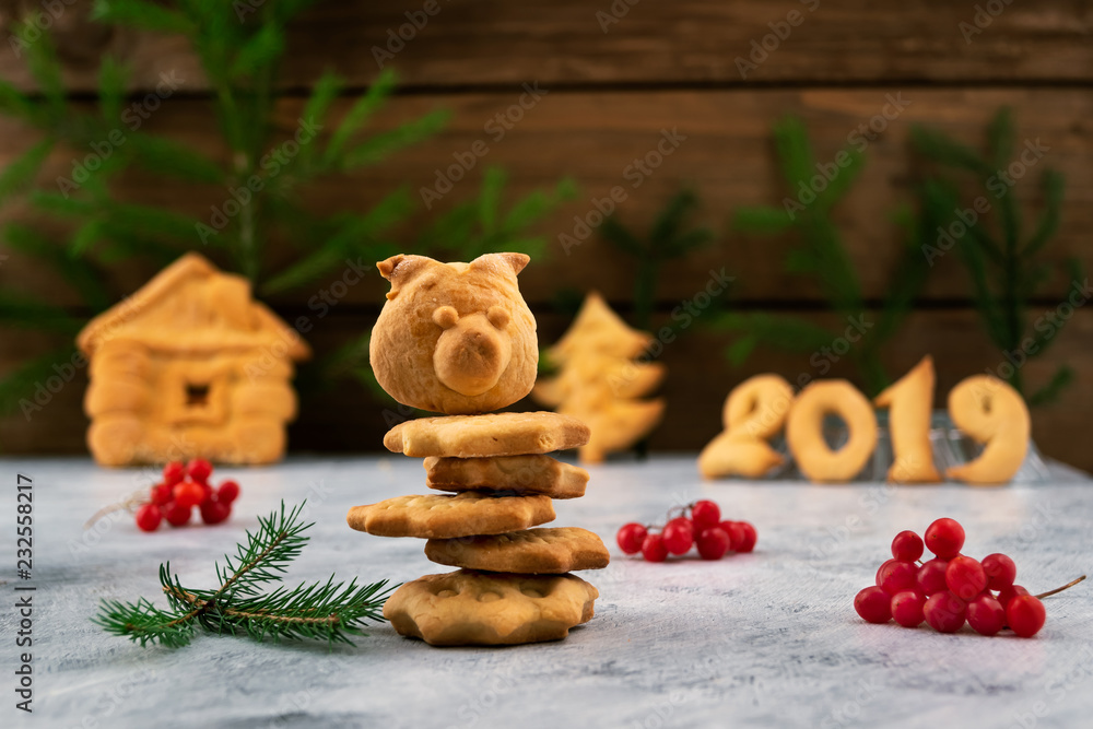 Home baking for the new year holidays-cookies in the shape of a house, Christmas trees, figures 2019, pig's head, Christmas card, Christmas decoration. Home baking for the new year holidays-cookies in the shape of a house, Christmas trees, figures 2019, pig's head, Christmas card, Christmas decoration.
