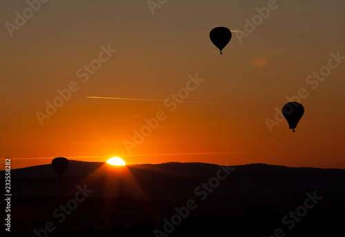 hot air balloons at sunset - freedom and adventure concept