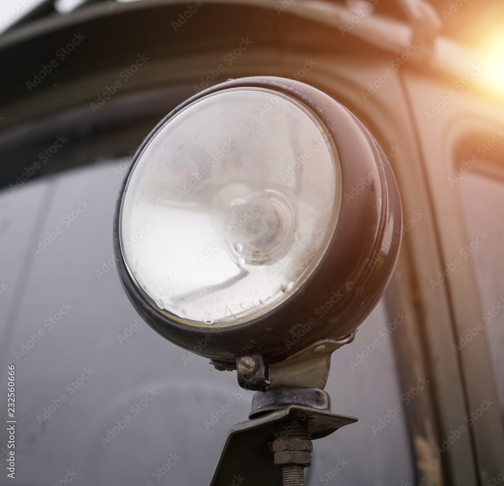 headlight on a military old car, world war concept
