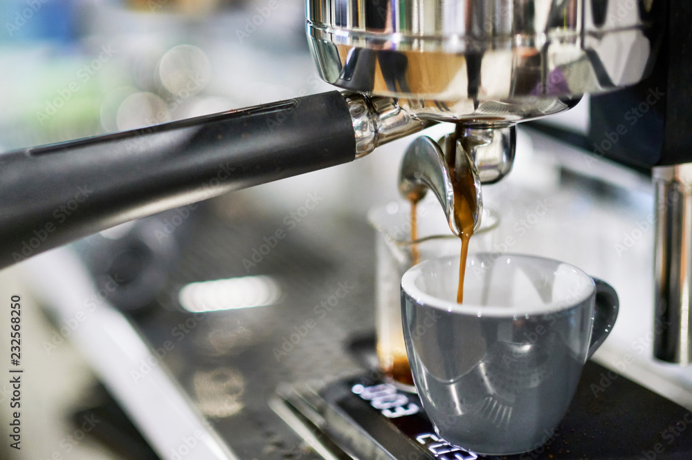 Coffee machine pouring espresso Coffee machine pouring espresso