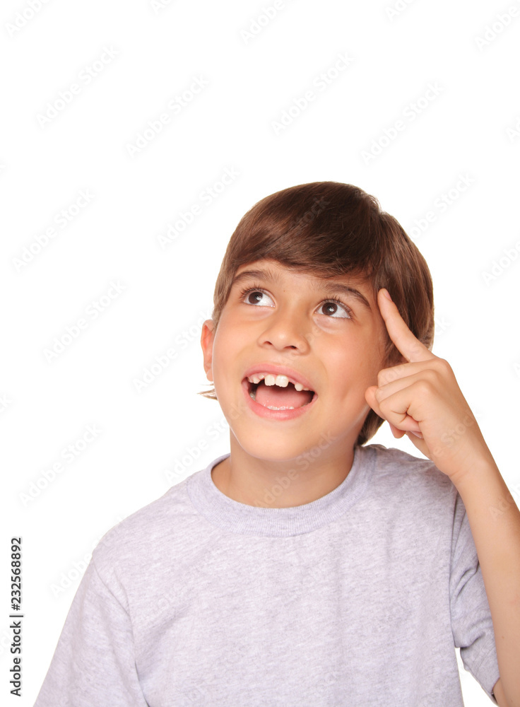 Kid touching his left temple with his index finger Kid touching his left temple with his index finger