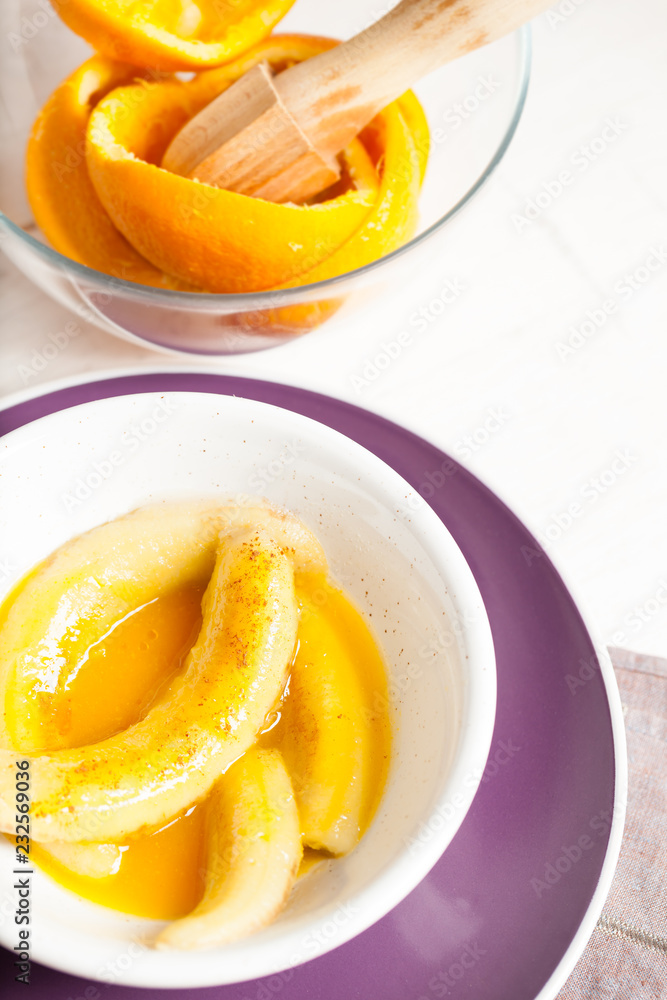 Fried bananas in orange sauce, a delicious dessert from fruits, butter and cognac. Fried bananas in orange sauce, a delicious dessert from fruits, butter and cognac.