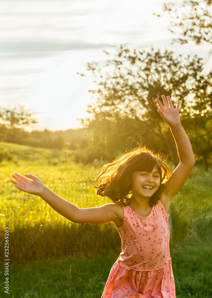 Little girl playing outdoors Little girl playing outdoors