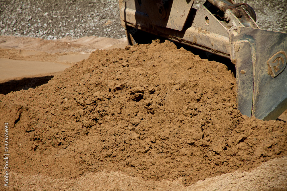 Moving soil at construction site Moving soil at construction site