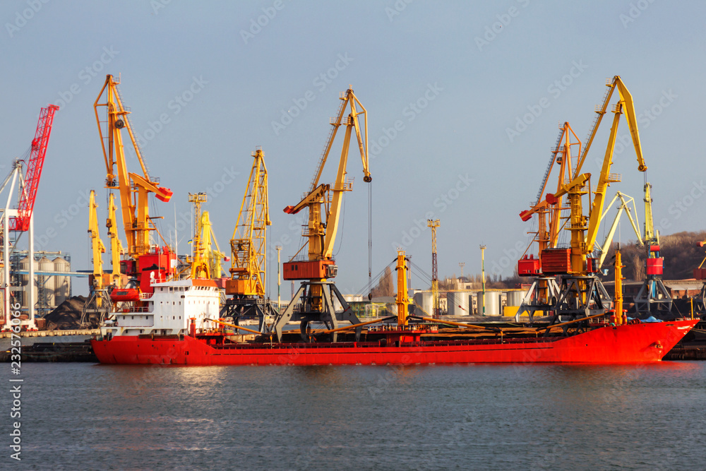 A large large cargo ship enters the harbor of a container terminal in the Odessa seaport, the largest Ukrainian seaport and a large cargo and passenger transport hub of Ukraine
