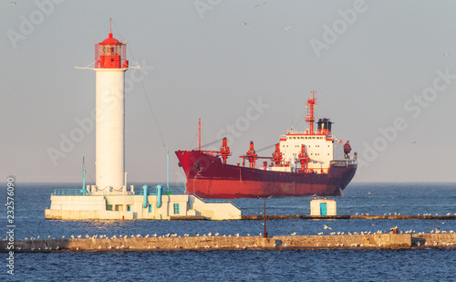 A large large cargo ship enters the harbor of a container terminal in the Odessa seaport, the largest Ukrainian seaport and a large cargo and passenger transport hub of Ukraine