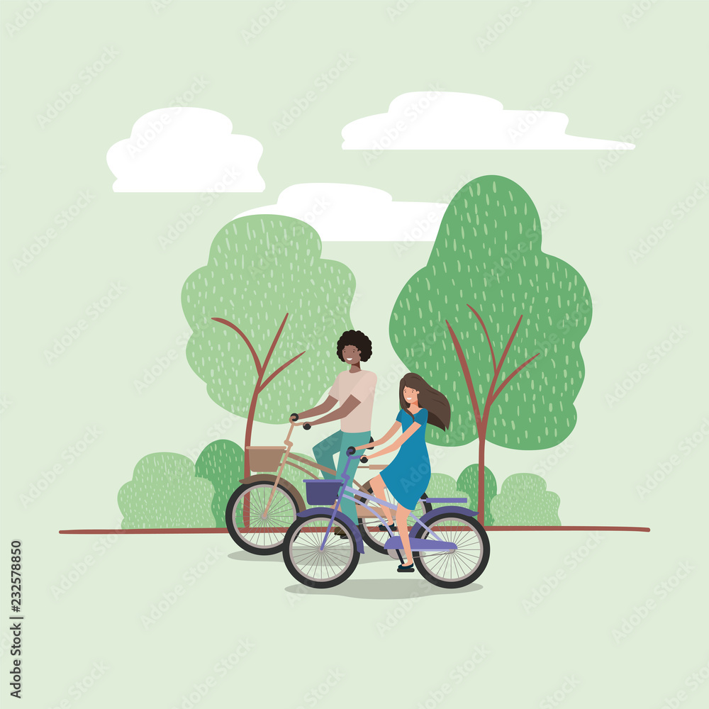 young couple on bicycle in the park young couple on bicycle in the park