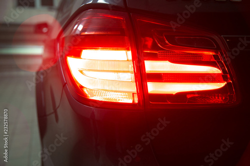 Detail of red metallized black rear car headlight 