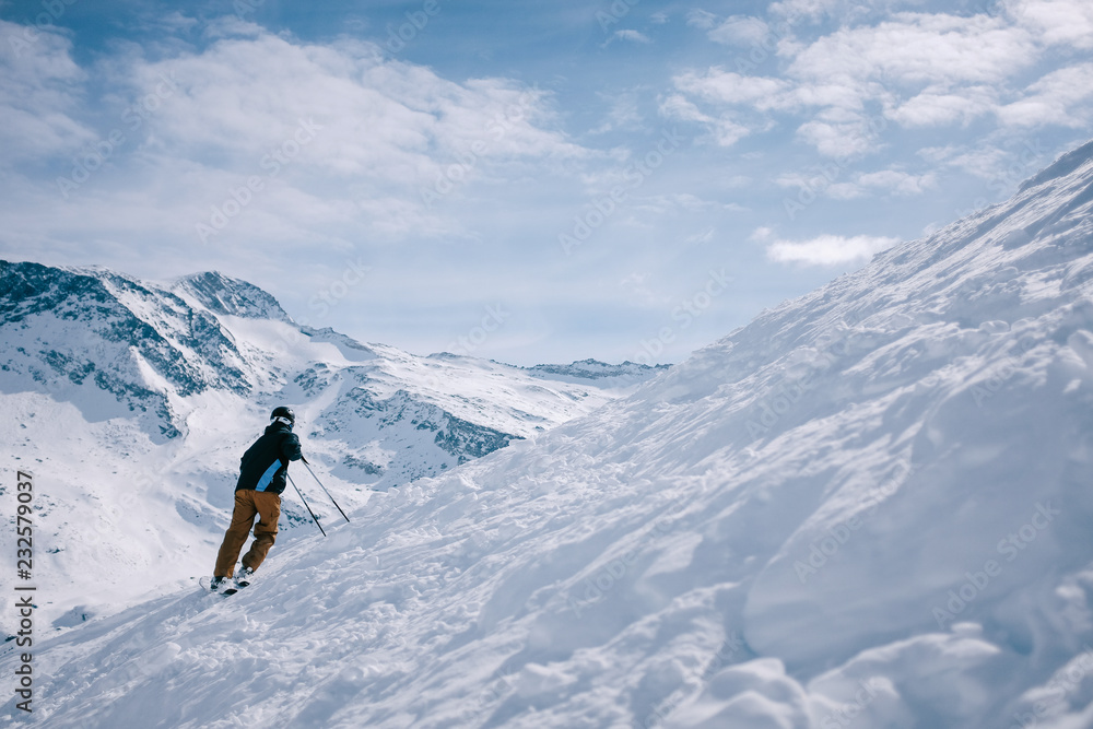 Man enjoying skiing and the beautiful view Man enjoying skiing and the beautiful view