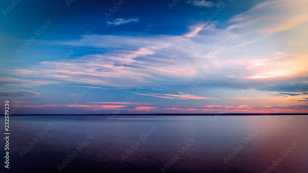 Sunset with Pink clouds over Lake Superior Horizon