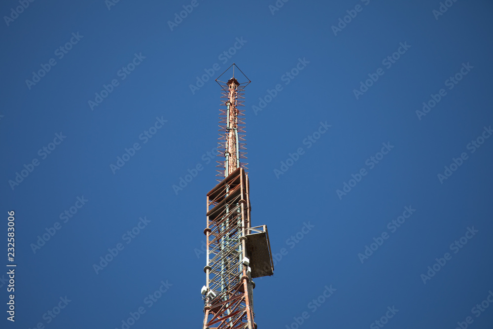 TV signal tower seen from a far distance TV signal tower seen from a far distance