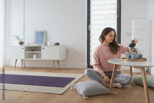 Caucasian woman relaxing at home drinking tea