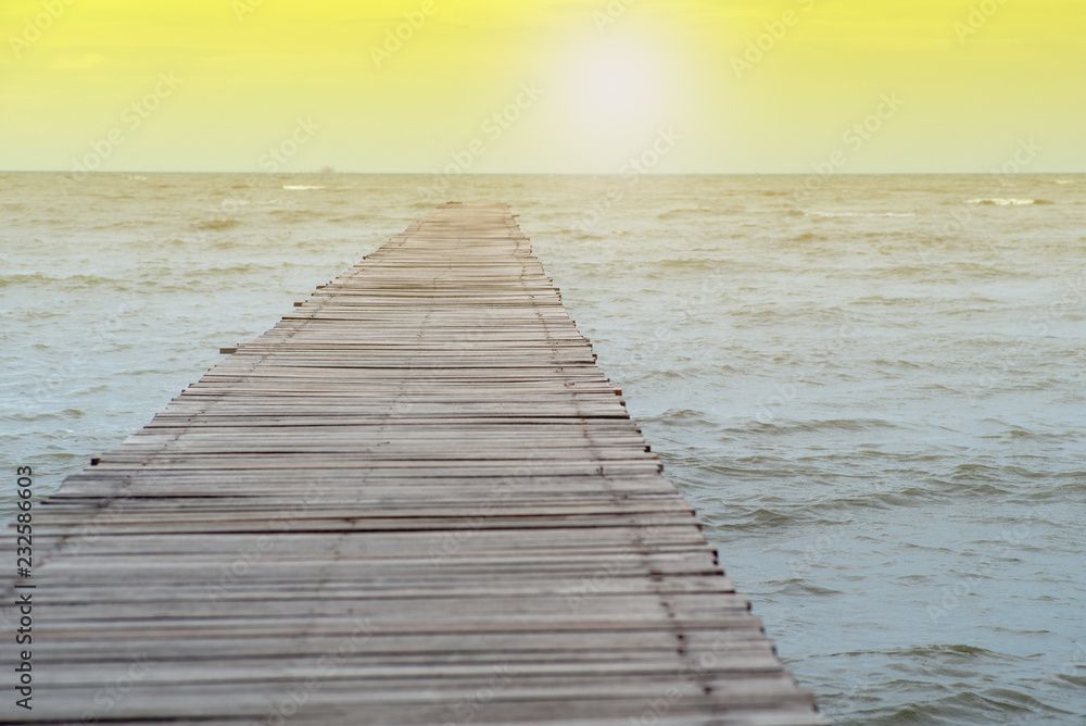 Fototapeta premium Abstract texture and background of wooden walkway into the sea. Wood bridge at the shore into the ocean