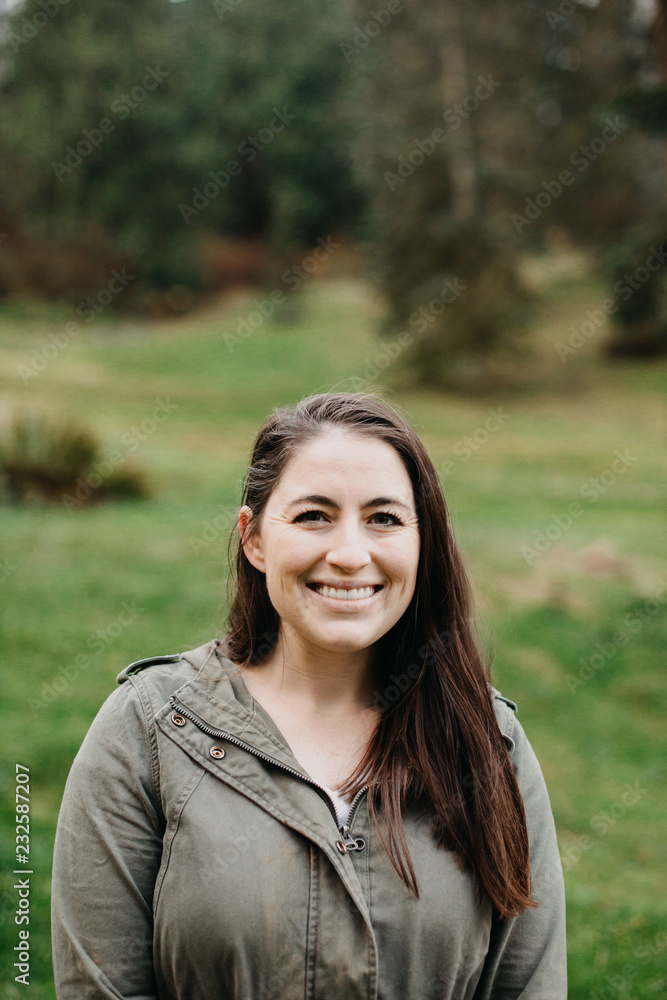 Portrait of Woman Outdoors in Green Hoodie Portrait of Woman Outdoors in Green Hoodie