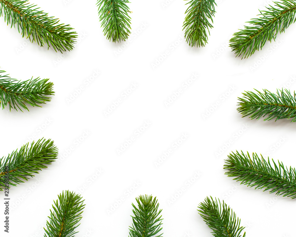 Christmas green framework with fir branches on white background. Top view Christmas green framework with fir branches on white background. Top view