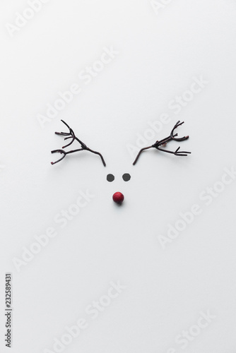 Minimalist reindeer made of paper and branches photo