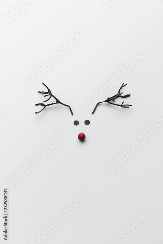 Minimalist reindeer made of paper and branches