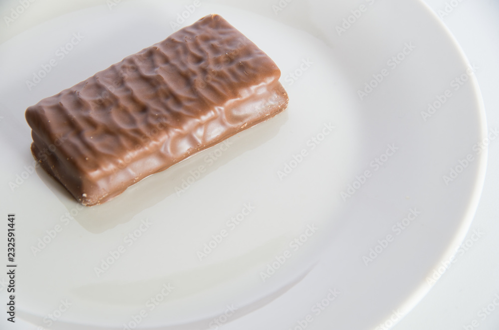Chocolate biscuit on a white plate Chocolate biscuit on a white plate
