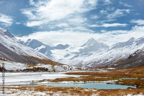 Snowcapped mountain and winter valley