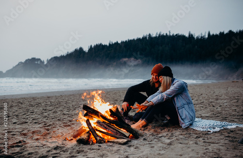 Beach bonfire and couple photo