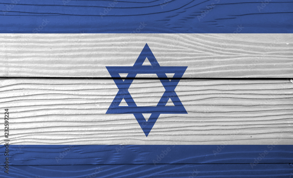 Flag of Israel on wooden wall background. Grunge Israeli flag texture, blue hexagram on a white background, between two blue stripes. Flag of Israel on wooden wall background. Grunge Israeli flag texture, blue hexagram on a white background, between two blue stripes.