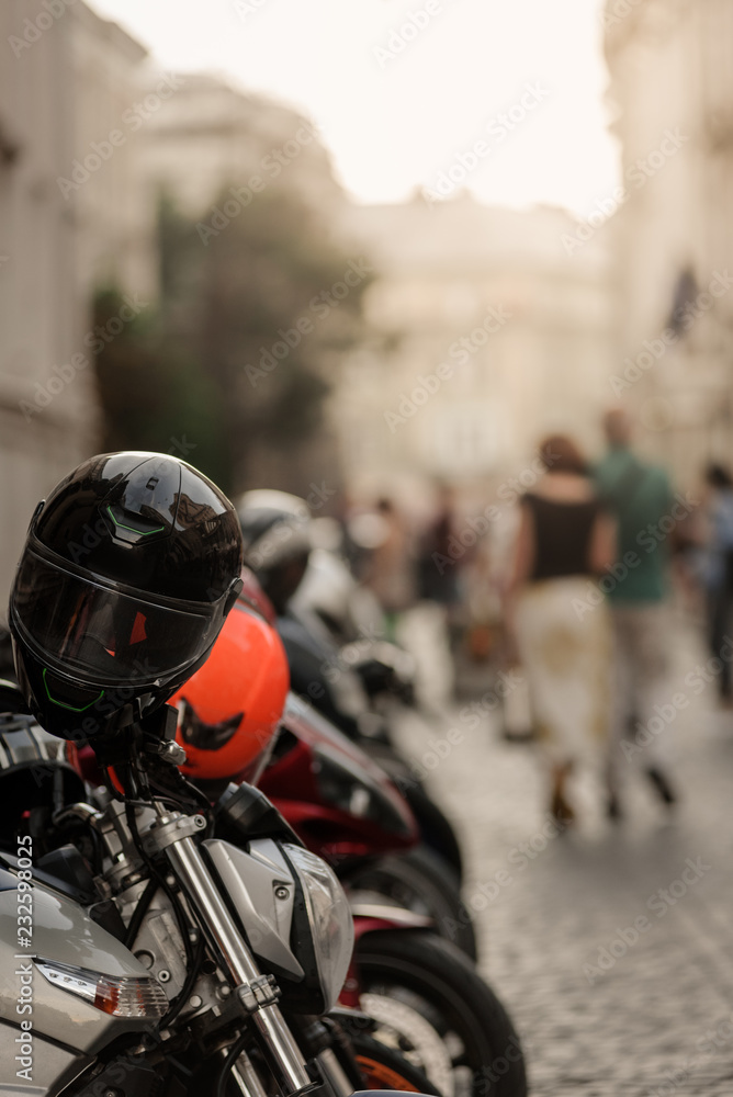 Motorbikes parked in pedestrian zone on old town street Motorbikes parked in pedestrian zone on old town street
