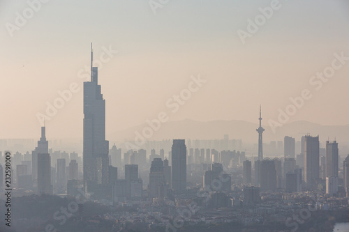 Nanjing, China. Severe air pollution, haze and poor visibility make the tall buildings in the city hard to see clearly photo