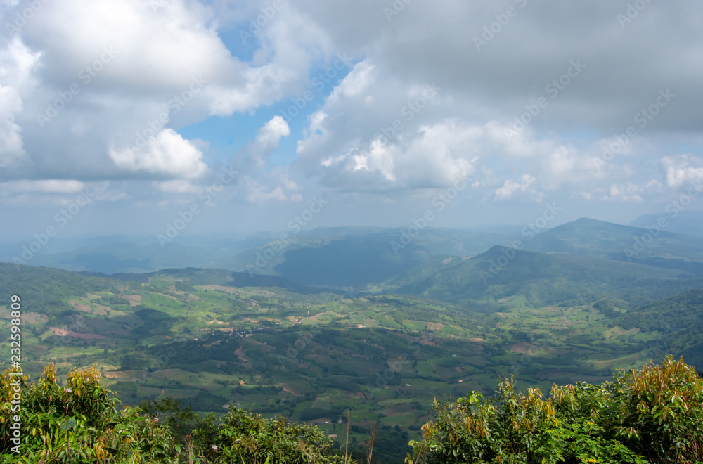 Fototapeta premium The point of view of the mountains and the town of Loei at Phu Ruea National Park in Loei, Thailand.