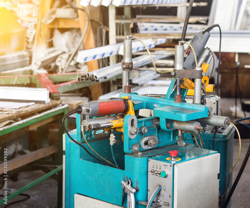 Production of PVC windows, a machine for making holes in the plastic profile of the PVC window, drill Production of PVC windows, a machine for making holes in the plastic profile of the PVC window, drill